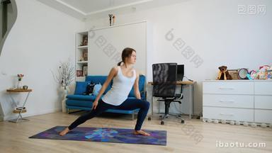 Young woman practicing <strong>yoga</strong> at home, stretching arm and leg